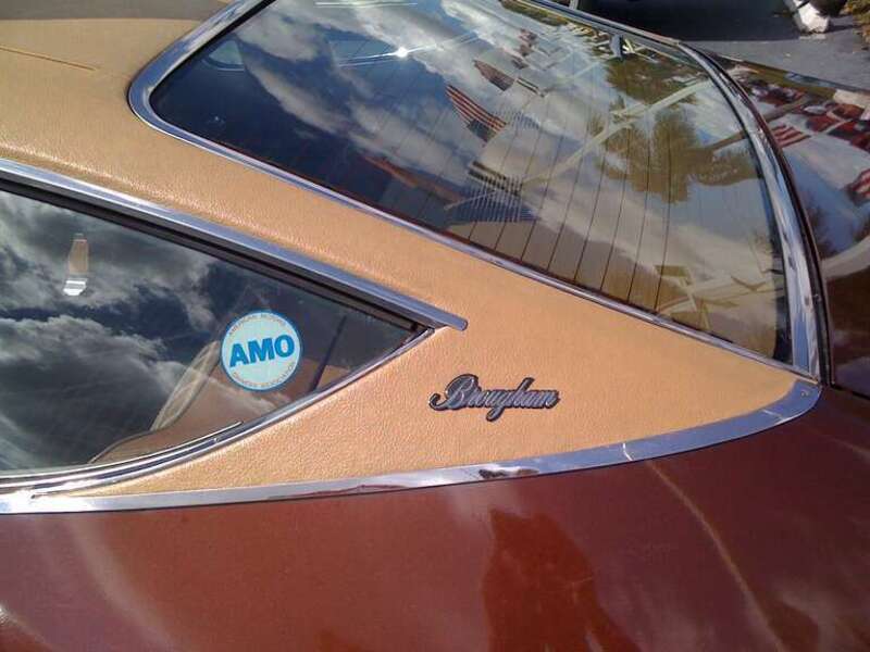 1976 AMC Matador Coupe - Brougham. Finished in Dark Cocoa Metallic (paint code: H4) with factory optional vinyl roof cover. Detail of &quot;C-pillar with model nameplate.