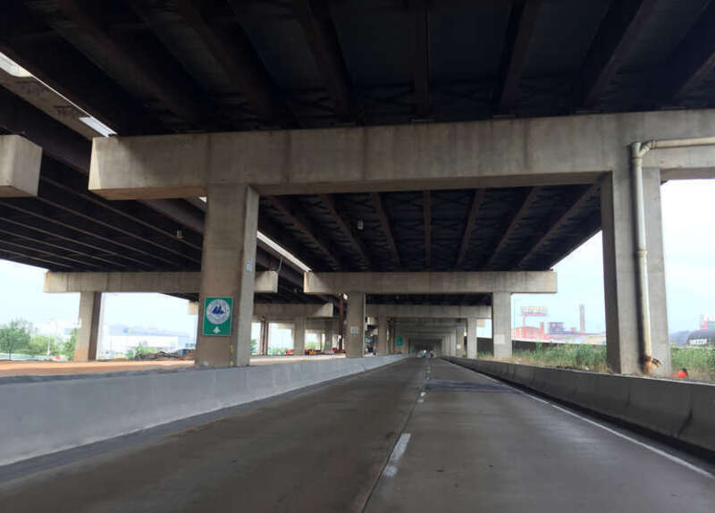 View south along Maryland State Route 2 Truck (McComas Street) just north of Cromwell Street underneath Interstate 95 in Baltimore City, Maryland