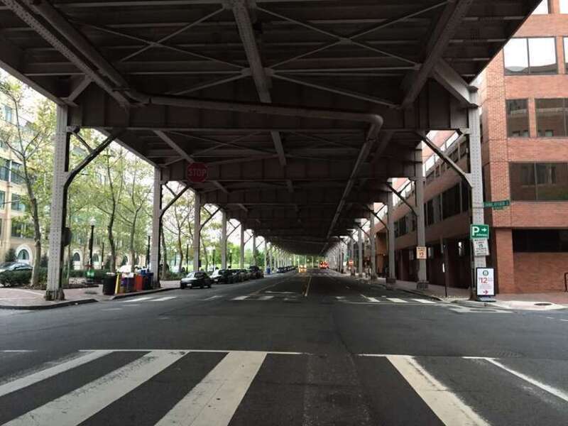 View west along K Street NW at Thomas Jefferson Street NW, directly underneath U.S. Route 29 (Whitehurst Freeway) in Washington, D.C.