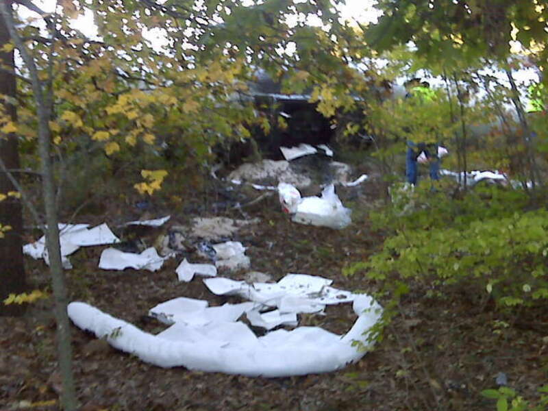 Releases associated with a crash:  100 gallons or less of asphalt plus an unknown amount of diesel from the truck saddle tanks.  
Response includes offloading of remaining asphalt from the tanker truck before it is moved, however the asphalt is hot