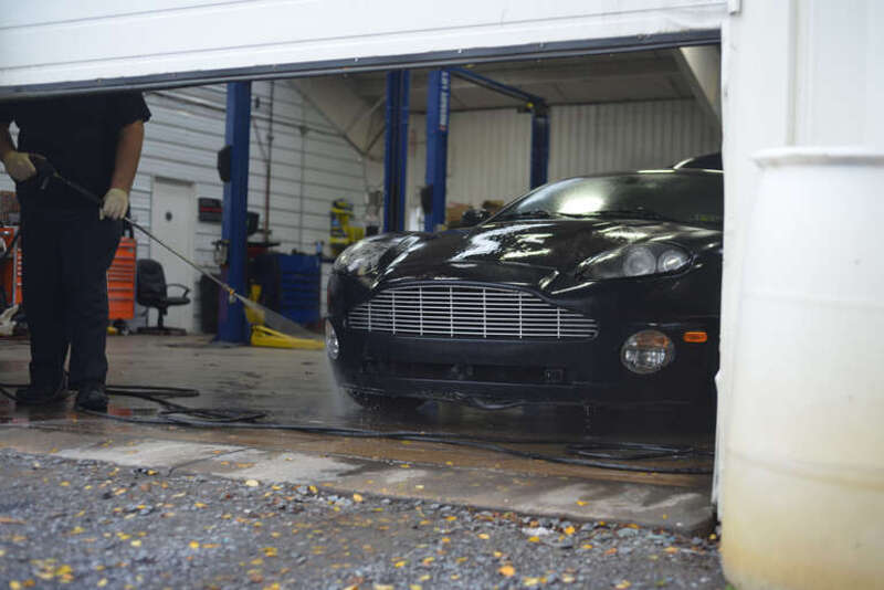 500px provided description: Aston getting a bath [#Car ,#Cars ,#Aston Martin ,#Automotive ,#V12]