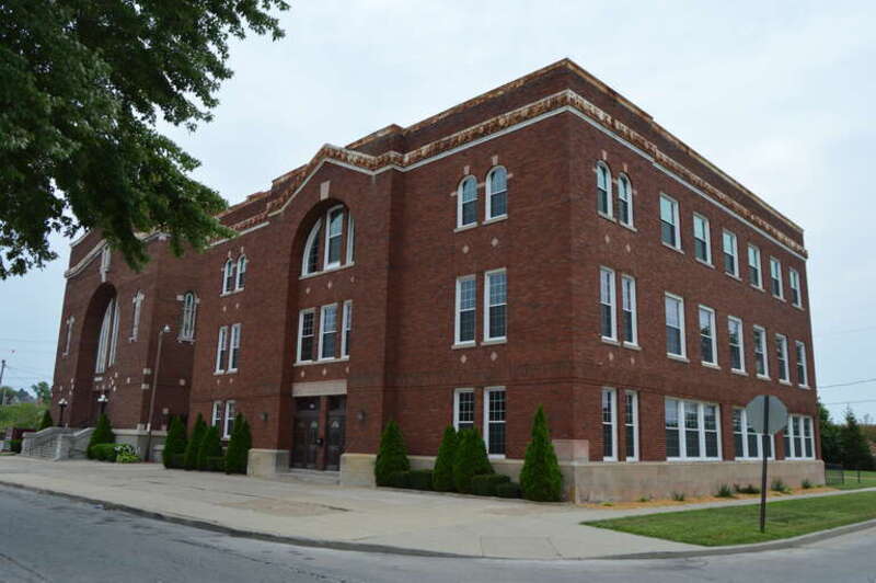 Front and southern sides of the former B'nai Israel Synagogue and its ancillary building (now the True Church of God of the Apostolic Faith), located 2546 N. Twelfth Street in Toledo, Ohio, United States.  Built in 1913, it is listed on the National