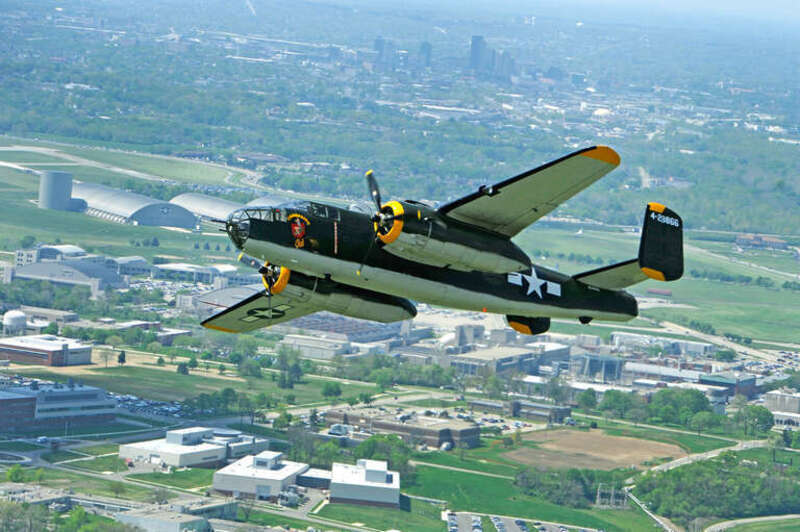 The Champaign Gal B-25 Mitchell bomber performs a flyby over the National Museum of the U.S. Air Force in honor of the 70th reunion of the Doolittle Tokyo Raiders.  (U.S. Air Force photo by Tech. Sgt. Bennie J. Davis III)
