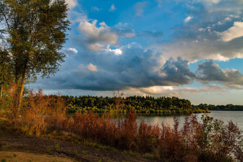 The sun sets over Big Woods Lake, as seen from the Big Woods Lake Campground in Cedar Falls, Iowa.