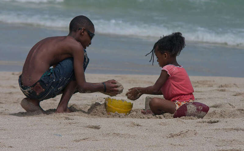 500px provided description: brother shows sister how to make sand castle [#brother sister sand castle]