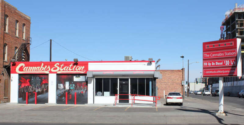 Cannabis Station, a medical marijuana dispensary located at the intersection of Lawrence Street and 20th Avenue in Denver, Colorado. The shop occupies a former gas station. Part of the text on the sign says, &quot;Fill Up on Diesel $30 ⅛'s.&quot;