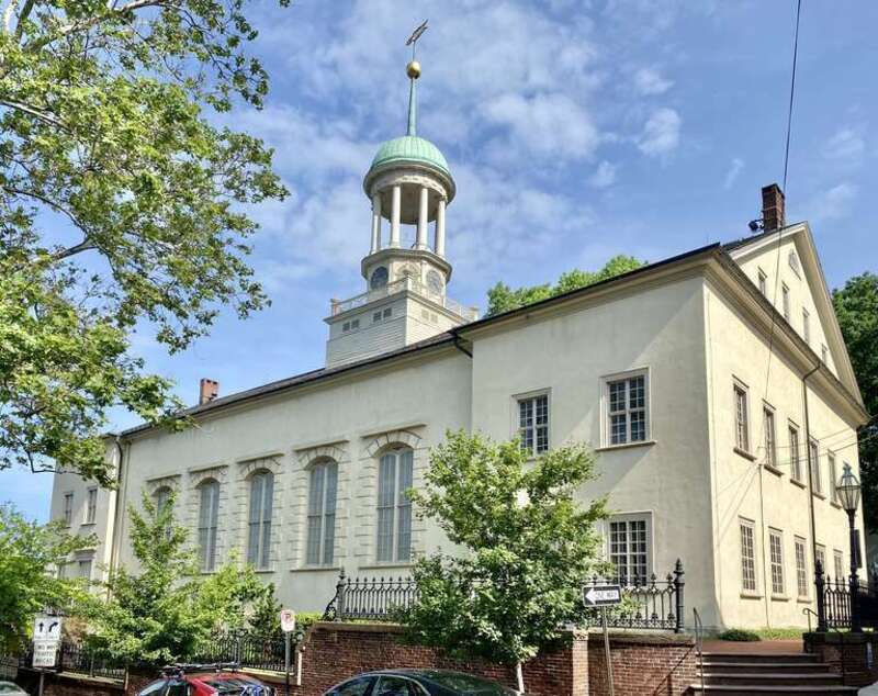 Built between 1803 and 1806, this Classical Revival-style church was built to serve the Moravian community in Bethlehem, which settled in the area during the mid-18th Century.  The building features a simple stucco-clad exterior with six-over-six and