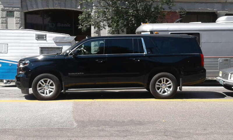 Chevrolet Suburban on Main Street in downtown Montpelier, Vermont during second annual Vermont Vintage Trailer Show.