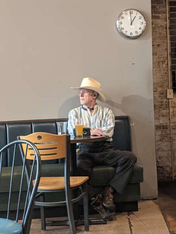 Two young men play chess at Taylor Books, 226 Capitol Street in downtown Charleston, West Virginia on the Fourth of July.