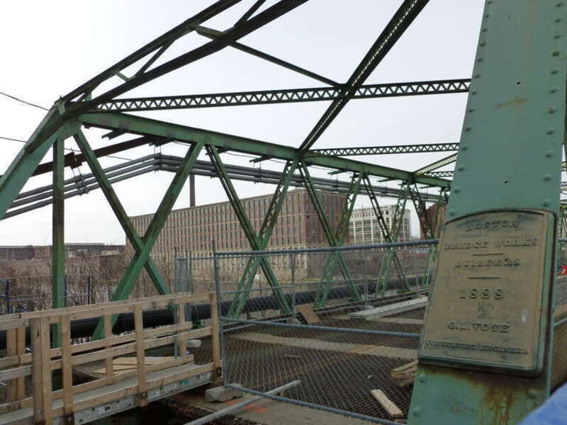 Duck Bridge under repair.  The bridge carries Union Street over the Merrimack River.  A plaque visible at right indicates the bridge was built in 1888.  It reads:
BOSTON
BRIDGE WORKS
---
BUILDERS
---
1888
G.L. VOSE

CONSULTING ENGINEER