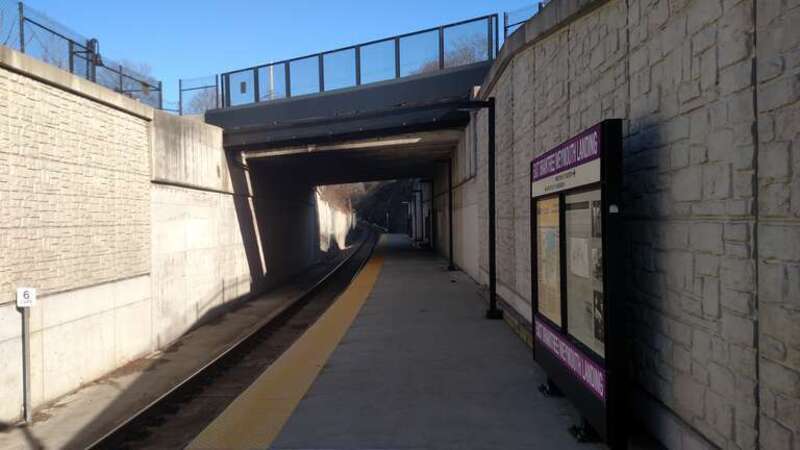 East end of the East Braintree/Weymouth Landing station platform in January 2017. The station was originally designed with a 450-foot platform that did not go under the Quincy Avenue or Commercial Street overpasses, but it was eventually built at
