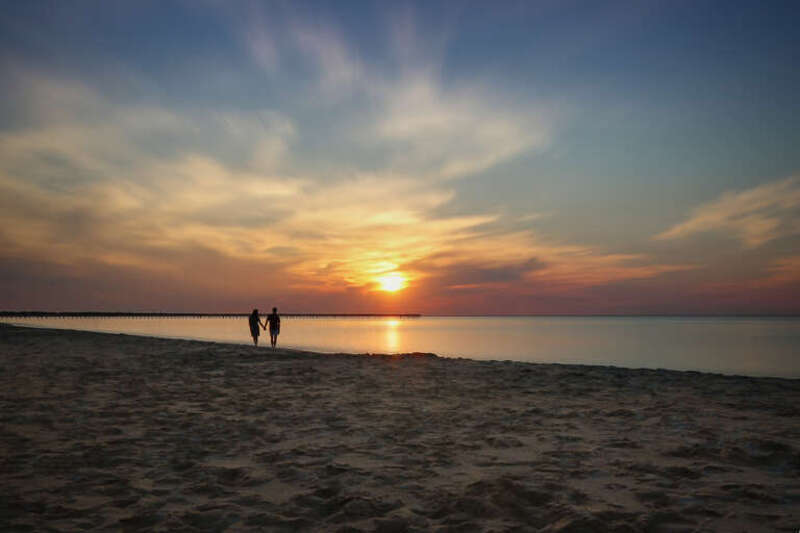 500px provided description: I captured a time lapse of the setting Sun, and in the frames a couple paused to watch the majestic scene come to a close. This is an Enfused image of 246 RAW frames and a composite of the couple during their one frame