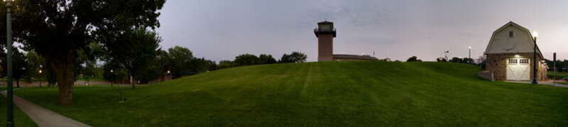 This is a panoramic view from the base of the highest hill in Falls Park looking to the southwest at the Observation Tower and the Horse Barn off to the right hand side.  It was another beautiful sunset as I composed this shot.