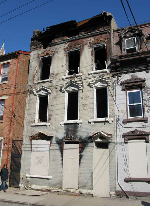 A fire damaged house near the intersection of Liberty and Republic Streets in Over-the-Rhine, Cincinnati, Ohio.