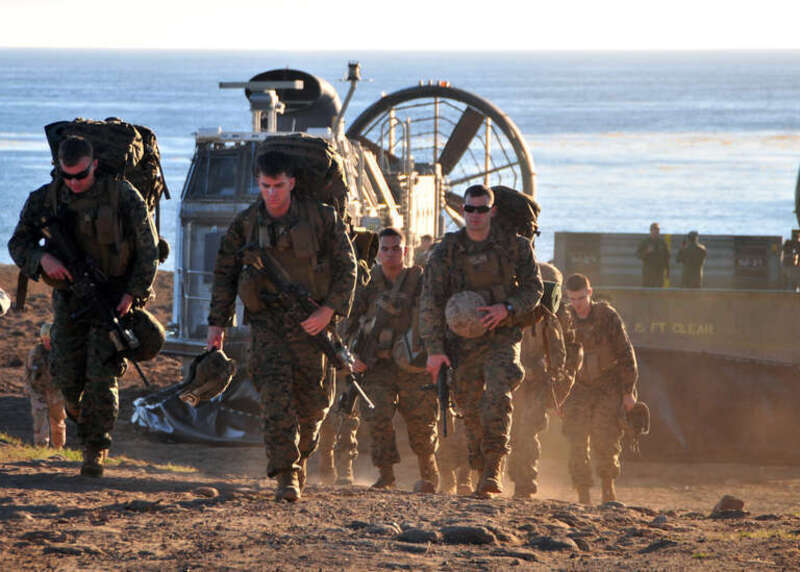 Marines from the 13th Marine Expeditionary Unit disembark Landing Craft Air Cushion 76 onto the beach on the west side of San Clemente Island, Calif. LCAC-76 is assigned to Assault Craft Unit 5 embarked aboard the amphibious assault ship USS Boxer.