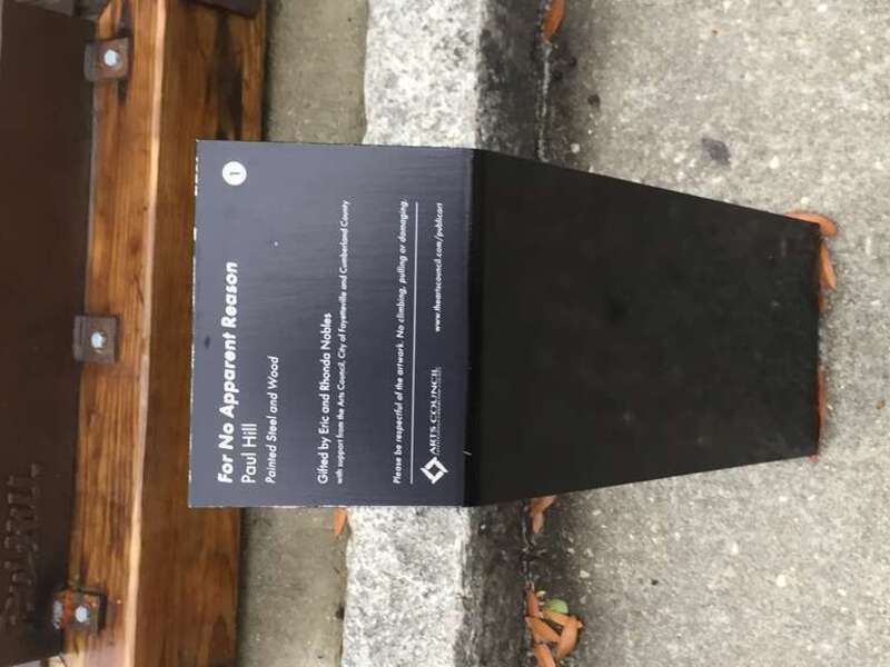 Informational marker. For No Apparent Reason. Painted steel and wood sculpture by artist Paul Wood. On public display in front of the Arts Council of Fayetteville, on Hay Street, in downtown Fayetteville, NC.