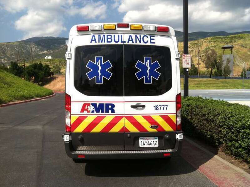 Ford Transit (2013) AMR Ambulance parked at CSUSB. Pictured back.