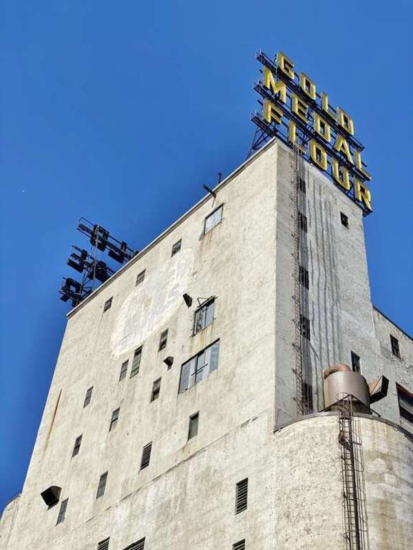 Built in 1908 by the Haglin-Stahr Company, this 185-foot-tall concrete structure was added to the adjacent Washburn, Crosby and Company A Flour Mill to increase production.  The structure consists of 15 cylindrical concrete bins with a 5-story