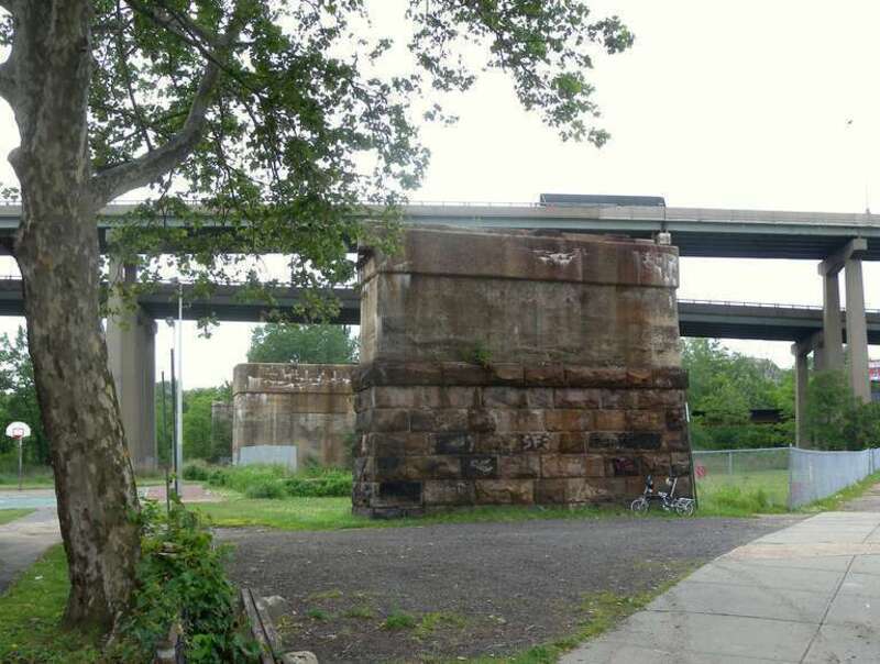Looking west at piers for Harsimus Stem climbing towards main line on a cloudy afternoon.