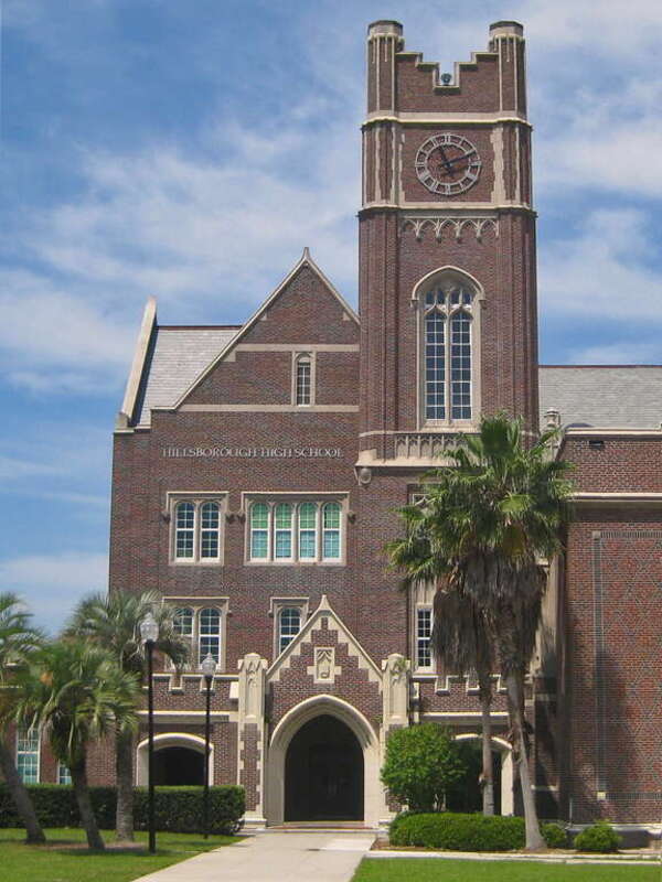 The clock tower and main entrance to Hillsborough High School in Tampa, Florida, USA.  Opened in 1928, the original Gothic revival-style building is a contributing structure within the Seminole Heights Residential District, a national and local