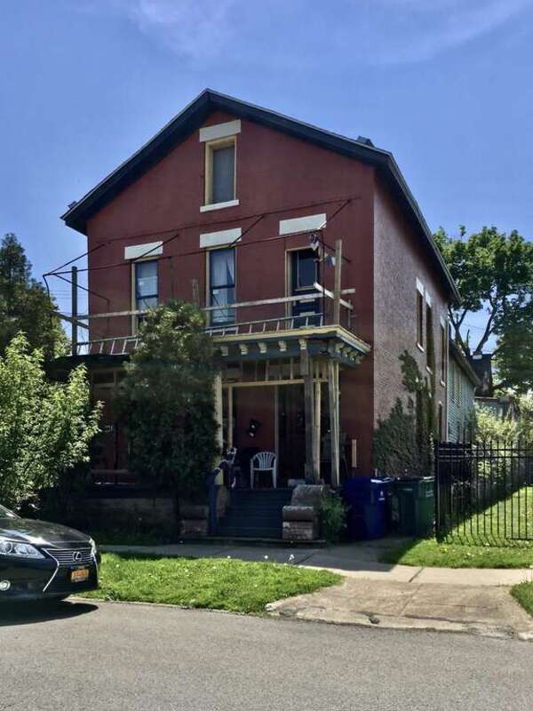 Besides being constructed of brick, unique among its neighbors in this block dominated by wood-framed residences, the two-and-a-half-story Greek Revival-style residence at 224 Plymouth Avenue is among the oldest buildings on the Lower West Side of