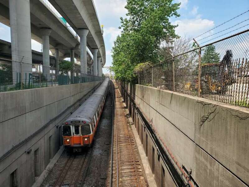 A southbound (inbound) Orange Line train entering the Charles River tunnel in July 2021
