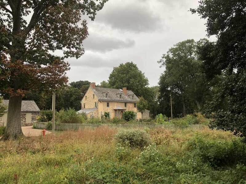 Front view of John Bartram's stone house &amp;amp; front meadow gardens at Bartram's Garden in Philadelphia, PA