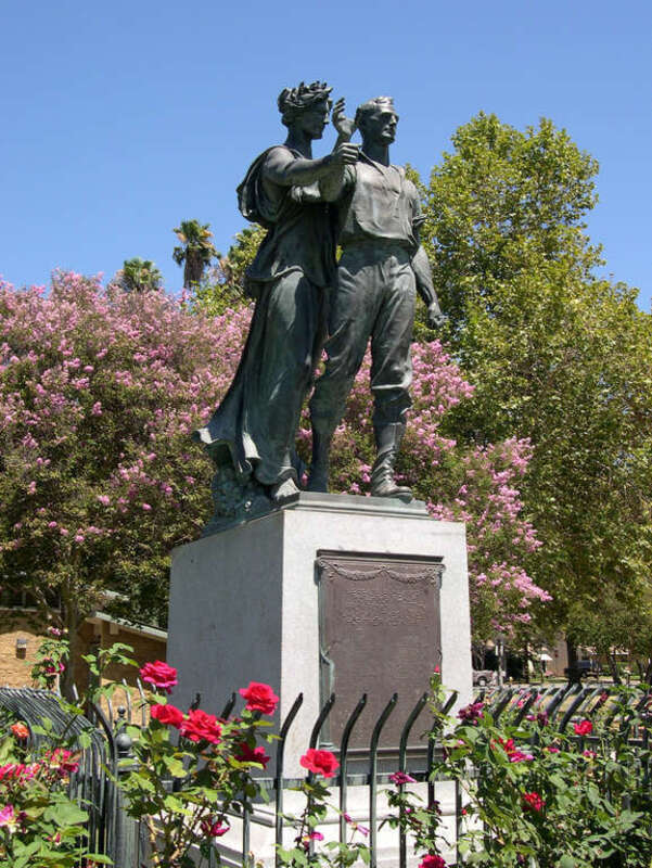 World War I Memorial sculpture. Originally the figures were holding a sword, later broken off by vandals, restored in 2016 by the Historical Society of Pomona Valley, and missing again as of 2017.