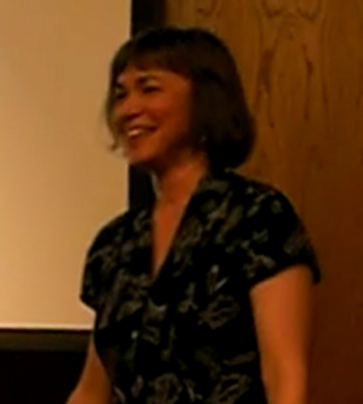 This image of professor and poet Kim Bridgford is extracted from my own video, taken by my girlfriend for me during my poetry award ceremony on April 22, 2010. The image has been slightly rotated, but otherwise unchanged.