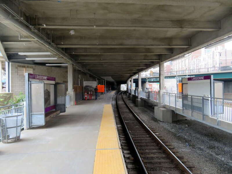 The eastbound platform at Lansdowne station under the new deck in July 2019