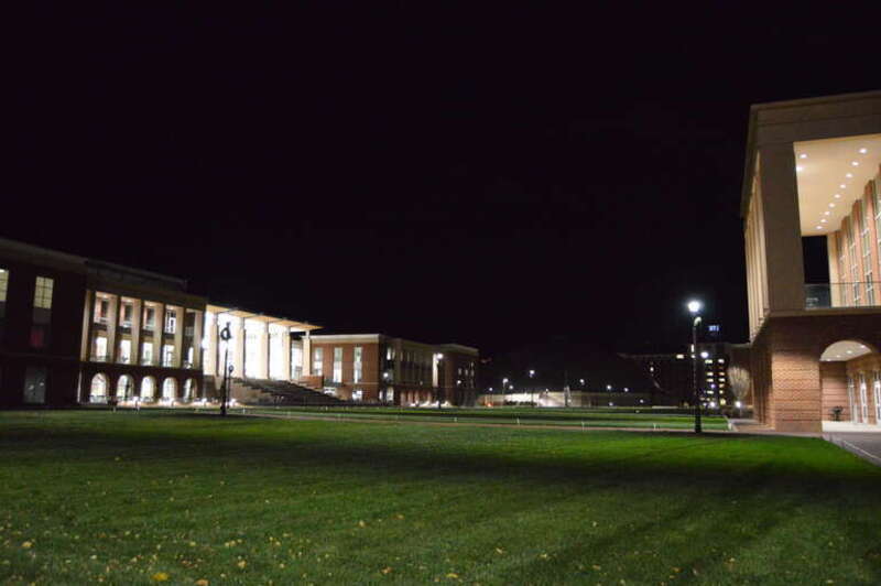 Night view of the central plaza at Liberty University in Lynchburg, Virginia, United States.  At left is the Montview Student Union, the unilluminated golfball-shaped building in the middle is the Vines Center, and Science Hall is visible at the