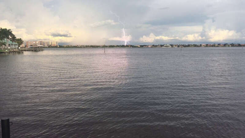 A view of a lightning strike, taken from the Cape Coral Yacht Club Park Fishing Pier in Cape Coral, Florida, facing east.