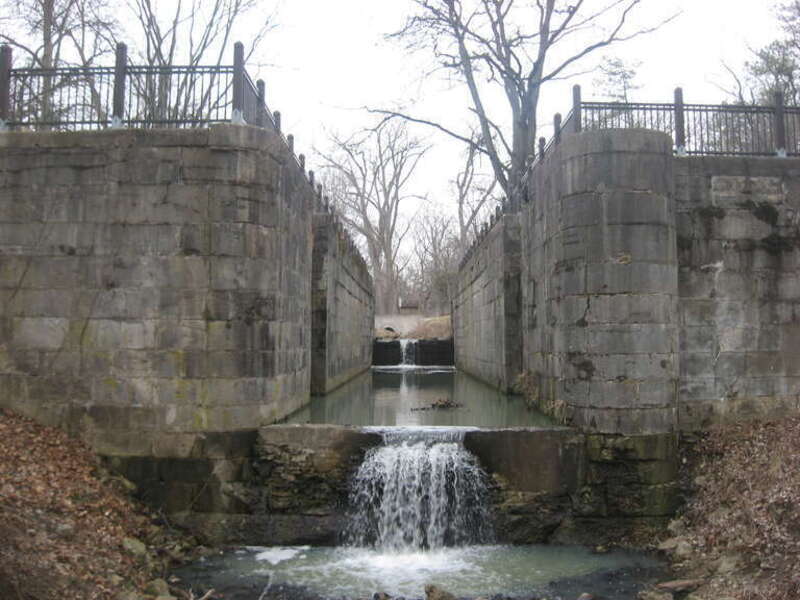Looking upward through Sidecut Lock Four of the Miami and Erie Canal toward Sidecut Lock Three at Sidecut Park in Maumee, Ohio, United States.  Built in 1843, the locks are part of the canal's Maumee Sidecut portion, which is listed on the National