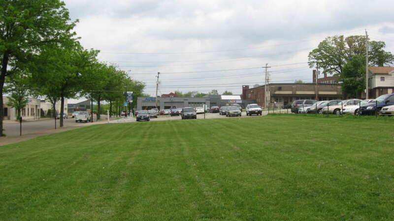 An empty lot on the northeastern corner of the junction of Market (State Route 18) and Summit Streets in downtown Akron, Ohio, United States.  This building occupies the site of the Eagles Temple, which was listed on the National Register of Historic