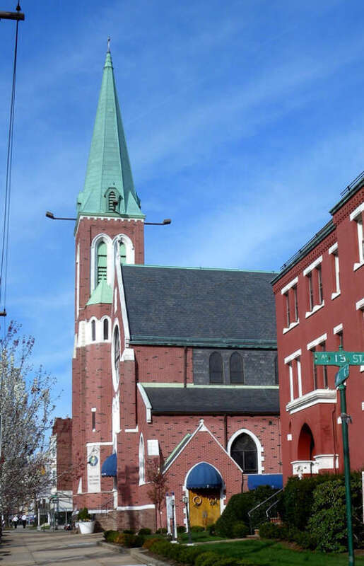 Looking northeast along Avenue C across 13th Street at St Mary's Star of the Sea on a sunny Easter Sunday early afternoon.