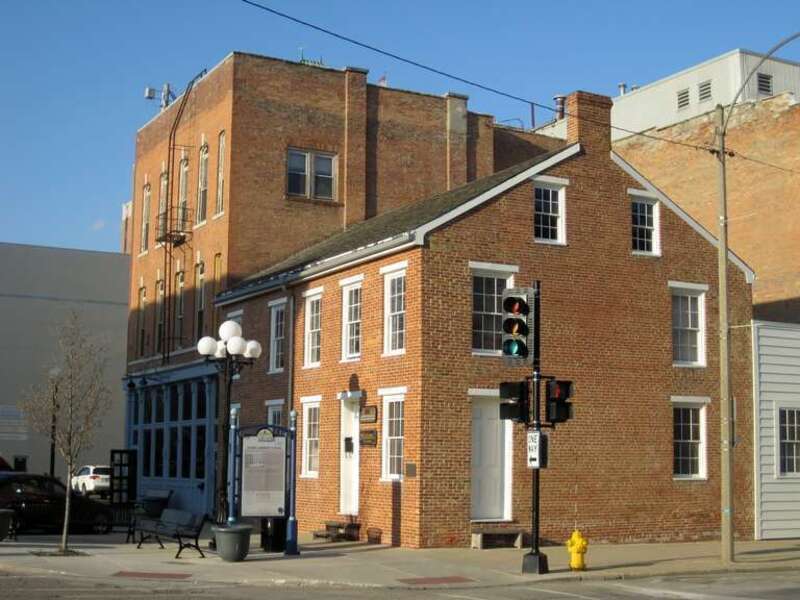 The Miller-Davis Law Buildings in Bloomington (1843). Built by James Miller and David Davis, they were the second and third brick business buildings in Bloomington. Today, they are the oldest buildings in downtown Bloomington and the only