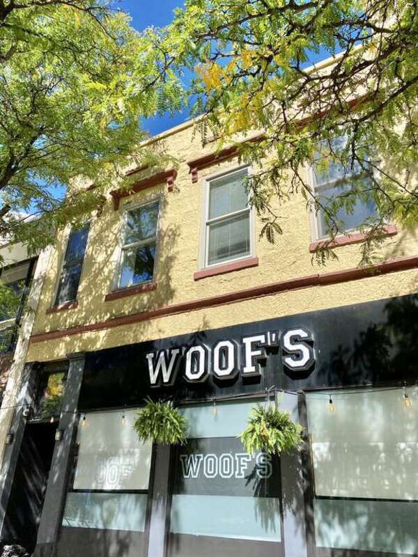 Built in 1855, this Italianate-style building was built by Simeon Mills, and was originally three stories tall.  The building features a painted sandstone facade with doric pilasters and modernized storefronts on the first floor, windows with