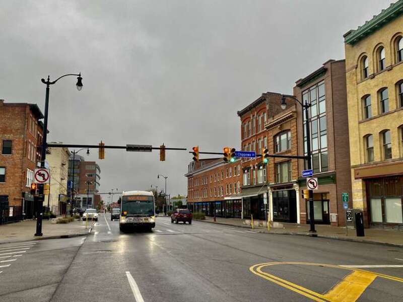 On an overcast October 2021 afternoon, an inbound NFTA Metro bus on route #24 plies its prescribed route along Genesee Street through the Genesee Gateway Historic District of downtown Buffalo, New York. The bus is headed for its western terminus at