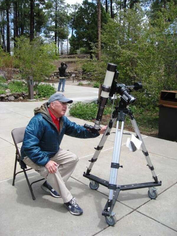 Lowell observatory had several excellent docents. This man helped me observe the Sun, and answered a lot of my questions. What a great volunteer.
Viewed through H-alpha (Hα) filter telescope.  H-alpha is a specific red visible spectral line created