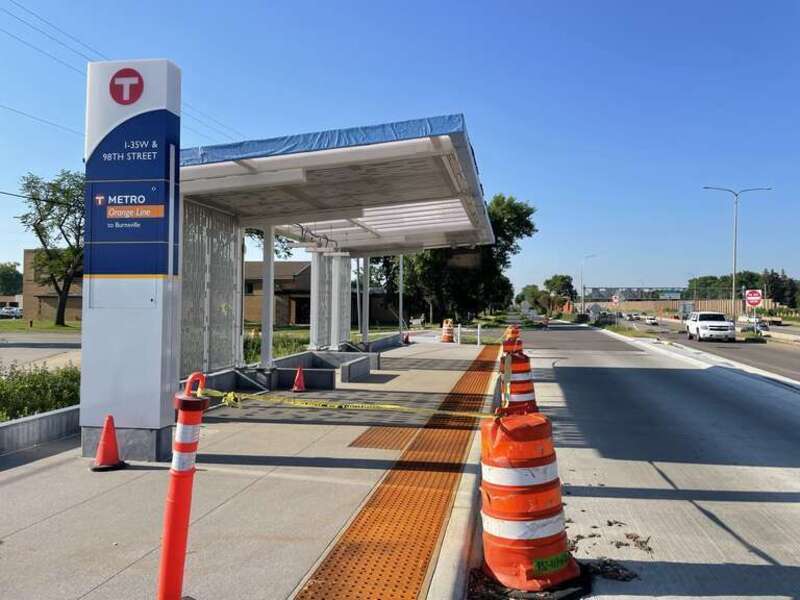 This shows the under construction I-35W and 98th St station of the METRO Orange Line on the site of the current South Bloomington Transit Center. The view is looking south with I-35W on the right. The northbound platform is directly behind the point