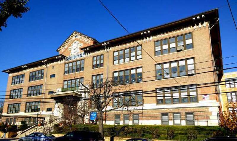 Looking north across 31st Street Bayonne, at PS 3, the Robinson School, on a sunny midday.
