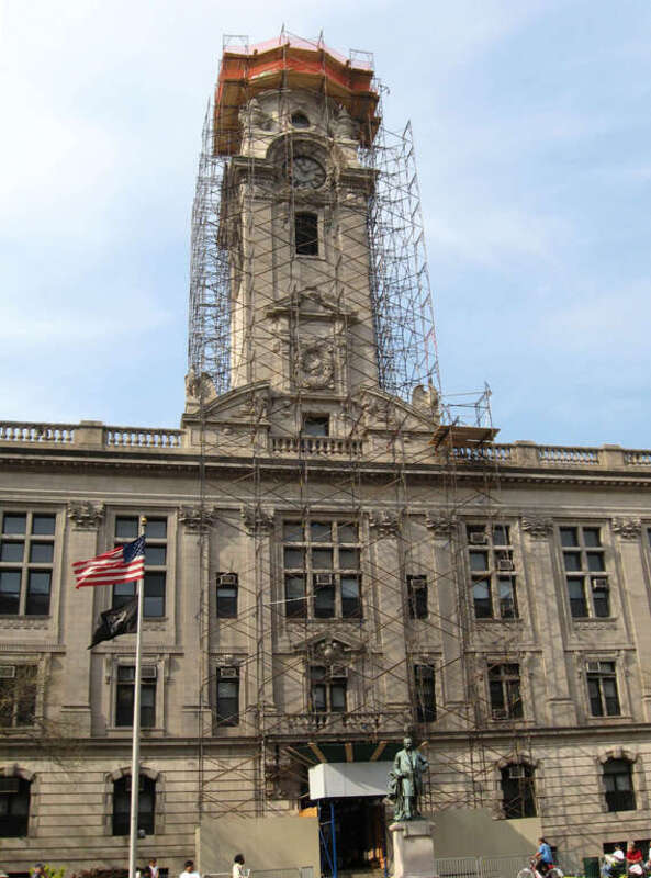 Paterson, New Jersey City Hall, looking north from across Market Street on a sunny afternoon with temporary scaffolding.