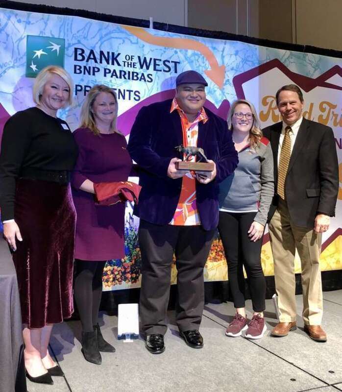 Pe'a accepts the prestigious distinguished alumni award from Colorado Mesa University in 2019.