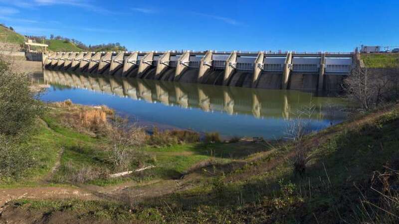 Photo shows Nimbus Dam on the American River, CA.