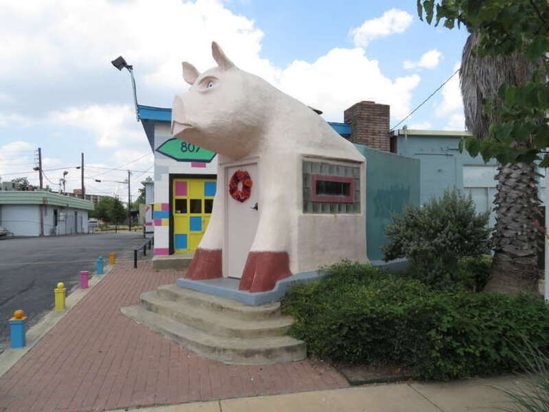 Pig building located on South Saint Marys Street near the intersection with Pereida Street next to the building at 807 South Presa Street, San Antonio, Texas.