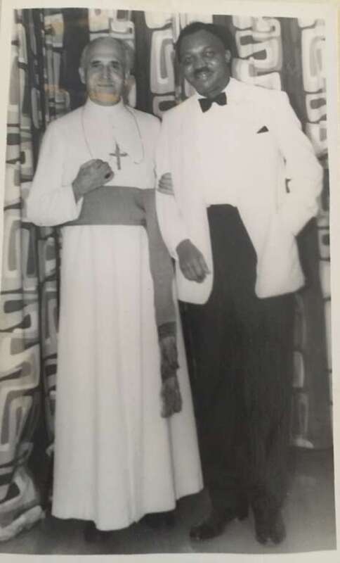 Mr Raymond Njoku with a Priest