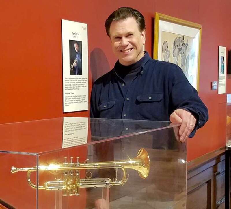 This is Roger Ingram standing next to the display of his Jupiter XO Brass 1600i Bb trumpet and Ingram V-cup mouthpiece at the Kentucky Museum's &quot;Instruments of American Excellence&quot; exhibit. Roger_Ingram