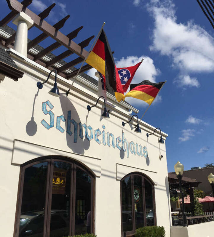 Front of Schweinhaus Memphis restaurant with German and Tennessee flags