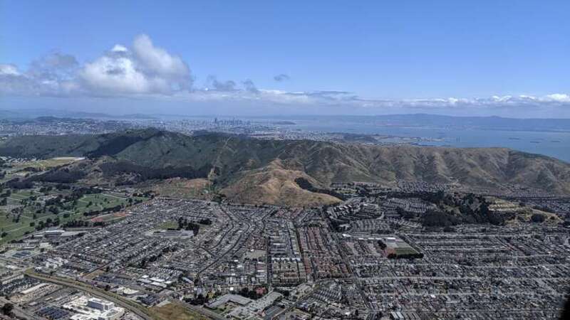 Aerial view of South San Francisco and San Bruno Mountain from the south on departure from SFO