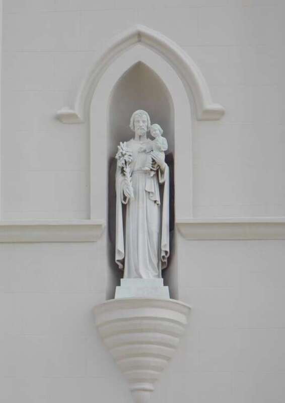 The statue of St. Joseph on the tower of St. Joseph Cathedral in Baton Rouge, Louisiana.  The church is listed on the National Register of Historic Places.